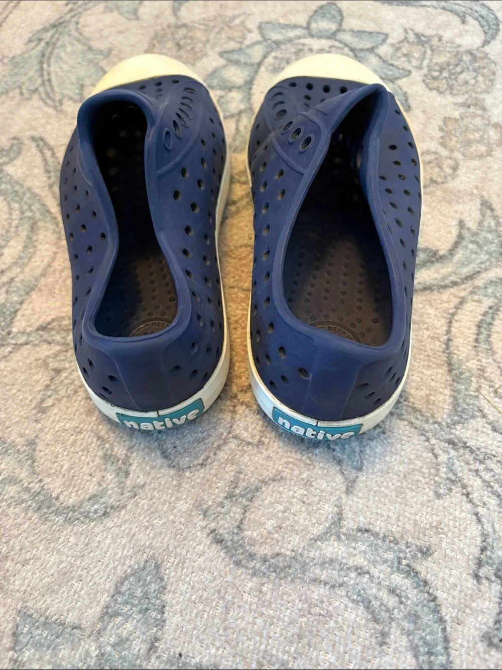 Navy blue boys Native shoes.